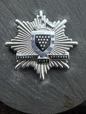 OBSOLETE ORIGINAL WEST CORNWALL BLACK SCROLL FIRE BRIGADE CAP BADGE.