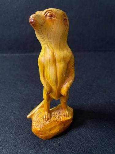 Hand carved resin - hand, meerkat
