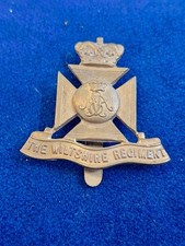 WILTSHIRE REGIMENT CAP BADGE IN BRASS ON SLIDER ORIGINAL