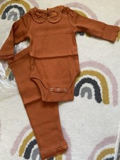 Dolly Wears Ribbed Bodysuit