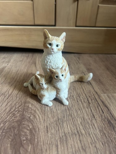 Cat sitting with kittens - sitting,
