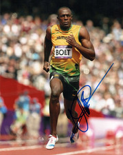 ATHLETICS: USAIN BOLT SIGNED 10x8 ACTION PHOTO+COA **JAMAICA**