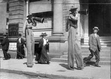 Men on stilts announcing the