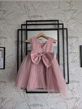 Pink tulle and satin flower girl dress with pearl details and detachable bow