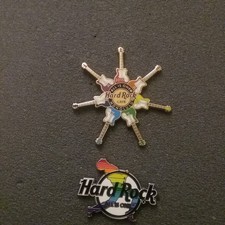 two Hard Rock Cafe badges theme is ALL IS ONE. MULTIPLE GUITAR BADGE DATED 2015