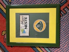 F1 Mika Hakkinen Lotus racing suit patches one signed, framed