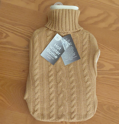 Beige hot water bottle - water,