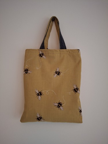 Hand sewn bumble bee shopping - hand,