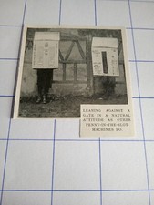 Penny slot machines leaning against a gate c 1899