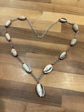 Vintage necklace with genuine cowrie shells, silver tone chain and coral beads.