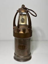 Antique miner's lamp in copper