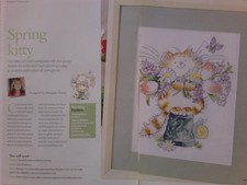 Cheery cat carrying Spring flowers picture cross stitch chart by Margaret Sherry