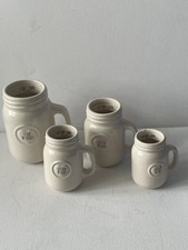 Four ceramic cups - , of