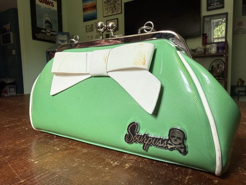 Green white sourpuss floozy - &,