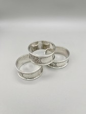 SET OF THREE GEORGE V STERLING SILVER NAPKIN RINGS, JOHN ROSE, BIRMINGHAM, 1919