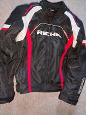 Men's Richa Falcon 2 motorbike jacket, size XL, black with red and white trim. 
