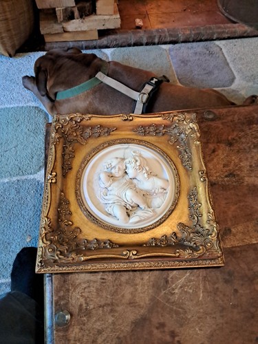 Bas relief gilt carved - in,