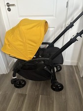 Bugaboo Bee 6 All-Black Stroller with Yellow Hood and Bumper Bar