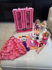 three 3 Barbie dolls with a