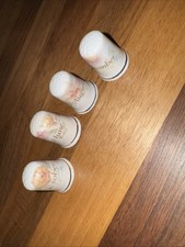 Four bone china thimbles