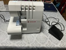SINGER OVERLOCKER S010L SEWING MACHINE. USED MACHINE BUT STILL VERY CLEAN.