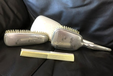 Vintage 4-piece dressing table vanity set; two brushes, mirror & comb in silver