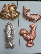 Five Tin cake /decorative wall moulds 