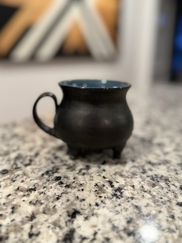Worried bones pottery cauldron - worried,