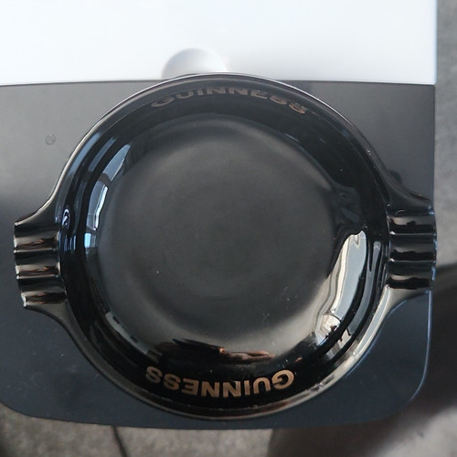 Guinness black glass ashtray - glass,