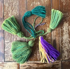 Five longbow arrow tassels