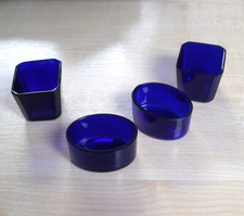 Set of four Bristol Blue glass liners for salts etc