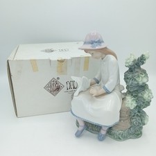 Nao by Lladro Porcelain Girl On Bench With Doves Figurine Multicoloured FLT-FPL
