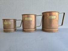Vintage set of 3 copper grain measures with brass handles