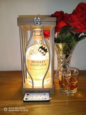 Monkey Shoulder whisky bottle lamp with 100 warm white USB LEDs in display cage