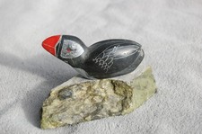 Alaska Native Inuit carved soapstone puffin on a stone base. Artist signed