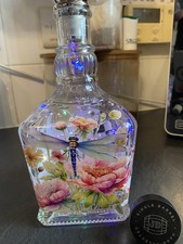 Upcycled jack daniels bottle, dragonfly and flowers design with solar lights