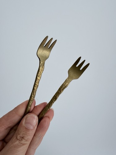 Two gold toned - two, or