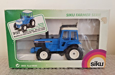 A BOXED SIKU FORD 8830 TRACTOR  VG COND (inner packaging has very slight damage)
