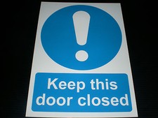 KEEP THIS DOOR CLOSED sign or