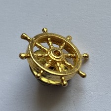 Ships Wheel Metal Badge. 
