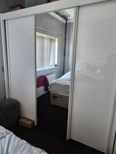 White Gloss double wardrobe with mirrored sliding doors.