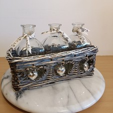 3 Glass Bottle Vases in Wicker Basket with 3 silver coloured hearts