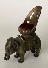 ANTIQUE BRONZE ELEPHANT WITH A
