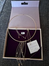 Linda Macdonald silver choker style necklace with silver and gold chillies. 