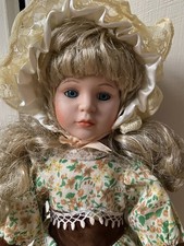 Porcelain doll in floral dress