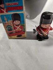 VINTAGE YONO TIN PLATE TOY WALKING GUARDSMAN
