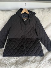 DKNY black mid length quilted black coat. New without tags. Size  medium/large.