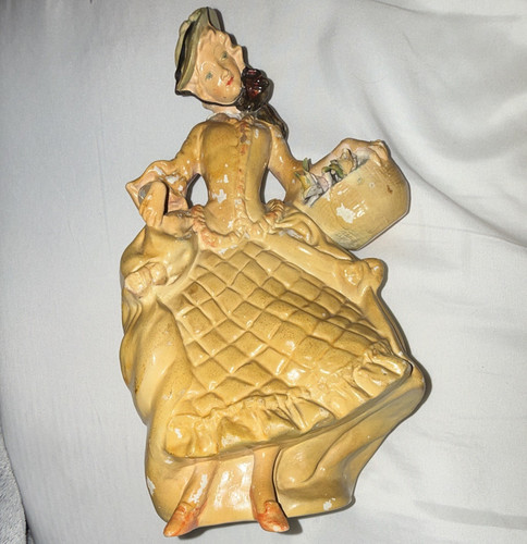 This vintage yellow figurine