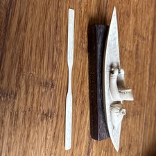 Antique Carved Inuit Figure In Kayak On Wooden Stand With Oar