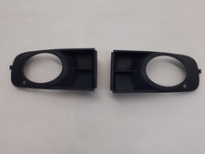ROVER 75 (99-03) PRE-FACELIFT FRONT BUMPER FOG LIGHT SURROUND TRIMS DXB100460/70